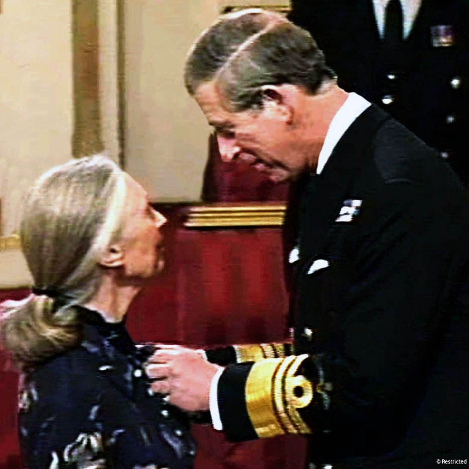 HRH Prince Charles invests Dr. Jane Goodall as Dame Commander of the British Empire in an Investiture Ceremony at Buckingham Palace. February 21, 2004.